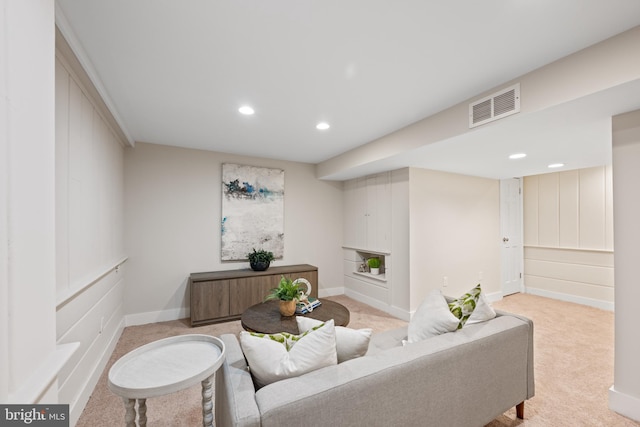 living room with baseboards, visible vents, recessed lighting, a fireplace, and light carpet