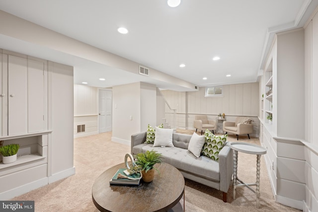 living room with light carpet, visible vents, recessed lighting, and baseboards