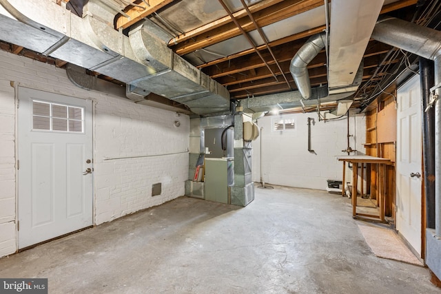 unfinished basement with heating unit