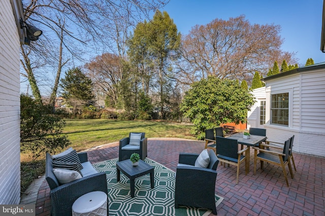 view of patio featuring outdoor dining space and outdoor lounge area