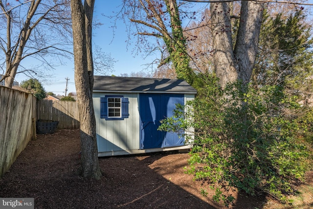 view of shed featuring a fenced backyard