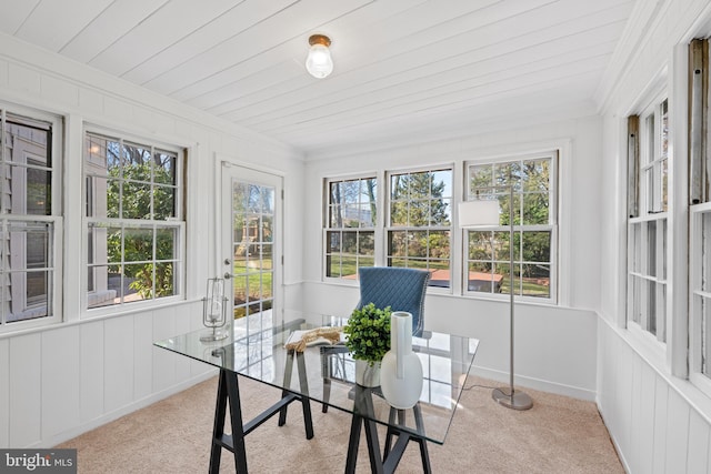 sunroom with a healthy amount of sunlight and wood ceiling