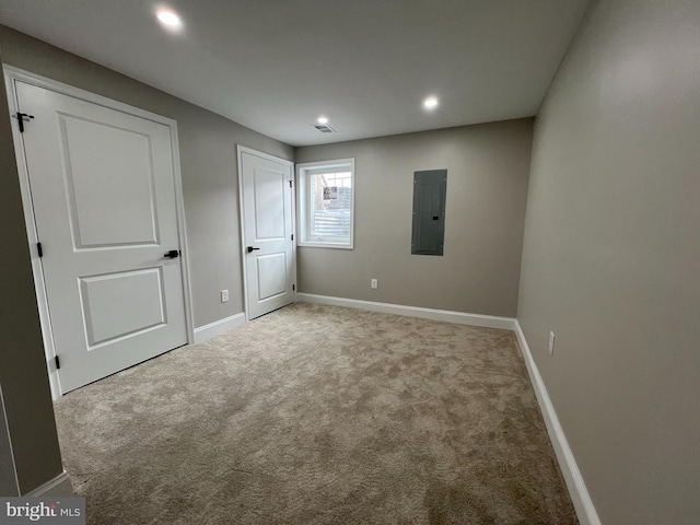 unfurnished bedroom with recessed lighting, visible vents, carpet flooring, electric panel, and baseboards