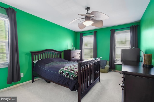 bedroom featuring baseboards, carpet floors, and a ceiling fan