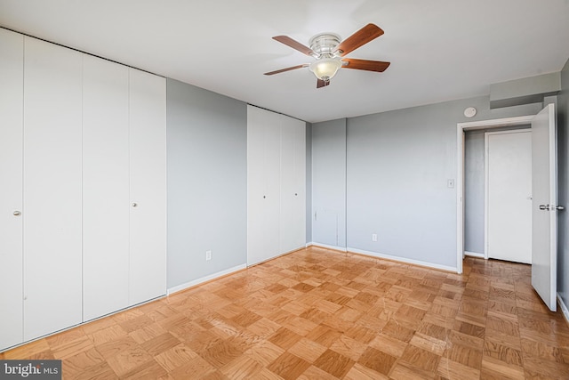 unfurnished bedroom with baseboards and ceiling fan