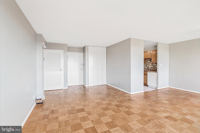 empty room with baseboards