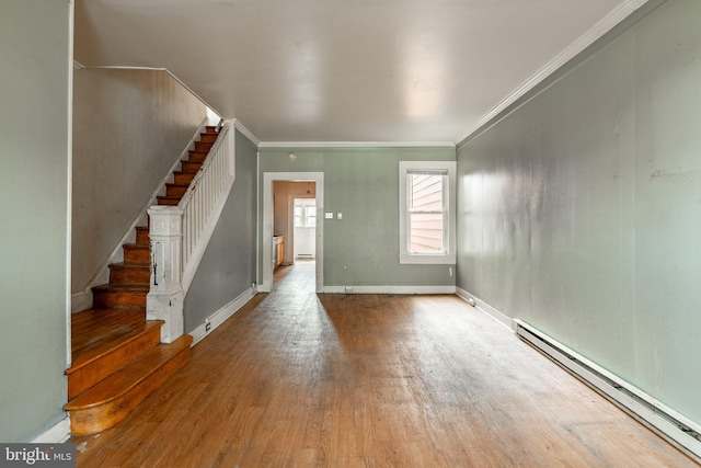 interior space featuring stairway, a baseboard heating unit, wood finished floors, and ornamental molding