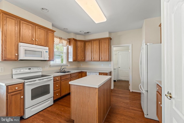 119 Glengarry Ln, Hainesport, NJ 08036 - kitchen with white appliances, a sink, a center island, dark wood-type flooring, and light countertops