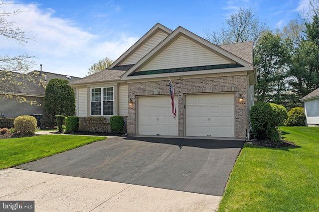 119 Glengarry Ln, Hainesport, NJ 08036 - view of front of house featuring brick siding, asphalt driveway, an attached garage, and a front yard