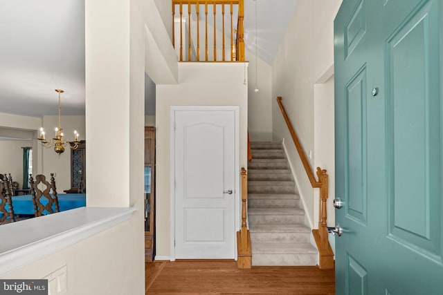 119 Glengarry Ln, Hainesport, NJ 08036 - entryway featuring a chandelier, wood finished floors, stairs, and baseboards