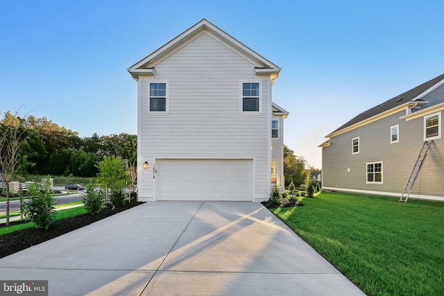 exterior space featuring a garage, concrete driveway, and a lawn