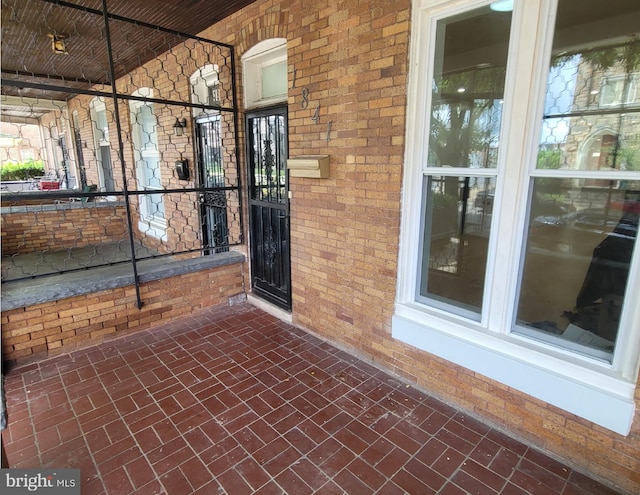 property entrance with covered porch