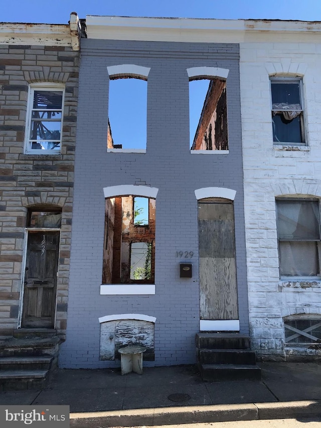 view of front of property with brick siding and entry steps