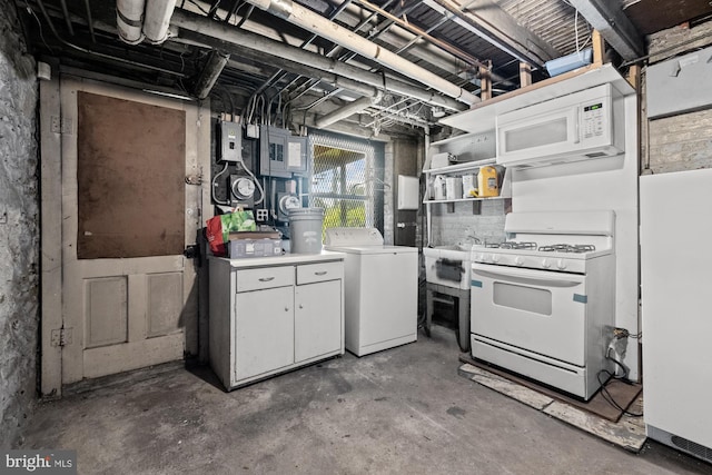 kitchen with white appliances, white cabinets, washer / clothes dryer, concrete floors, and open shelves