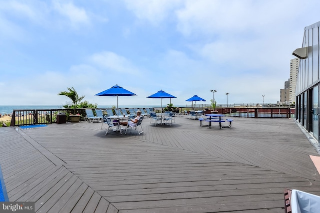 wooden deck with a water view