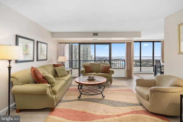 living area featuring visible vents and baseboards