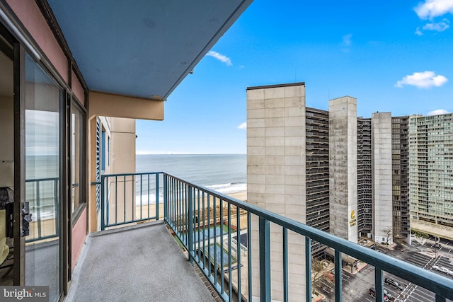 balcony featuring a water view