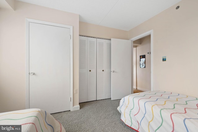 bedroom with a closet and baseboards