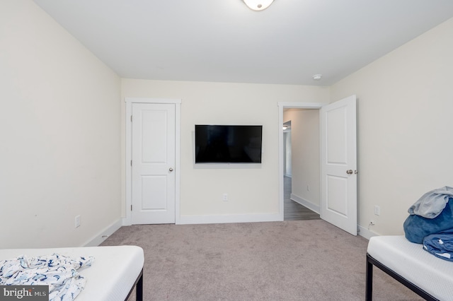 bedroom with carpet and baseboards