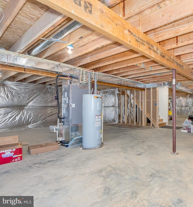 unfinished below grade area featuring stairs, heating unit, and water heater