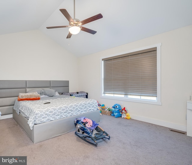 bedroom featuring visible vents, a ceiling fan, carpet floors, baseboards, and vaulted ceiling