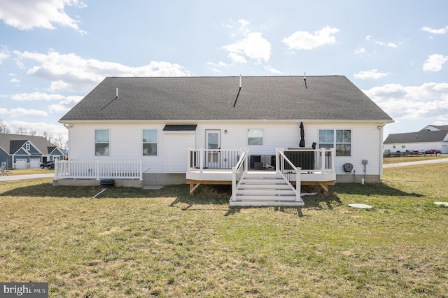 back of property featuring a lawn, central AC, a deck, and roof with shingles