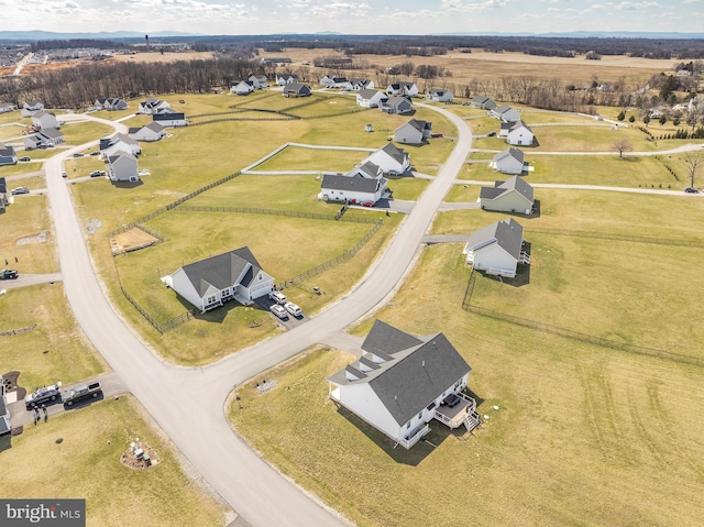 aerial view featuring a rural view and a residential view