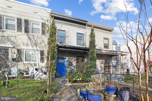 view of property with fence