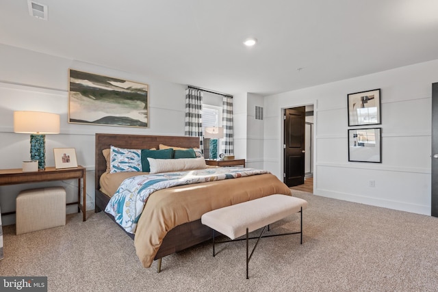 carpeted bedroom featuring recessed lighting, visible vents, and baseboards