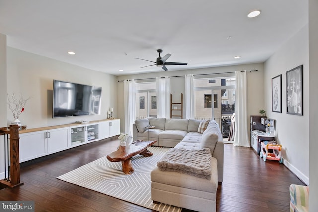 living room featuring a ceiling fan, dark wood-type flooring, recessed lighting, and baseboards