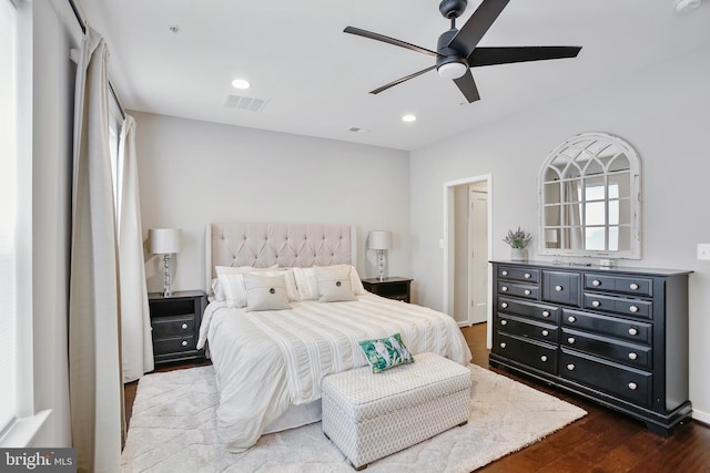 bedroom featuring dark wood finished floors, visible vents, recessed lighting, and a ceiling fan