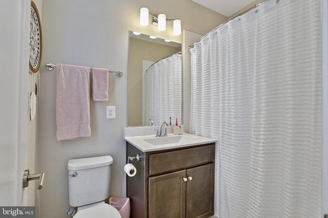 full bathroom with vanity and toilet