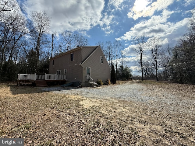 view of side of home featuring a deck