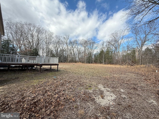 view of yard with a wooden deck