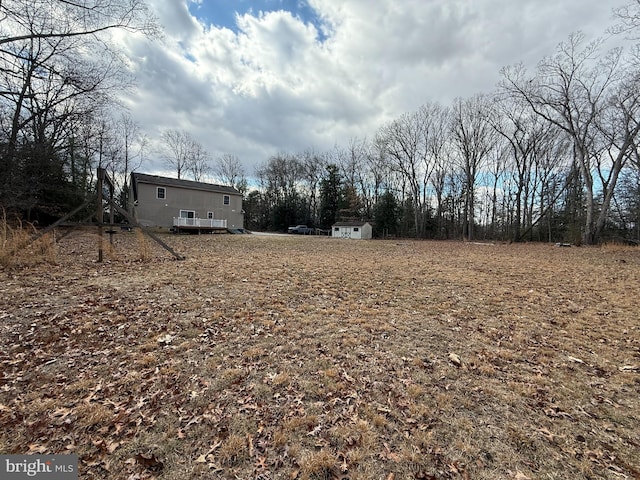 view of yard featuring an outbuilding and a storage unit