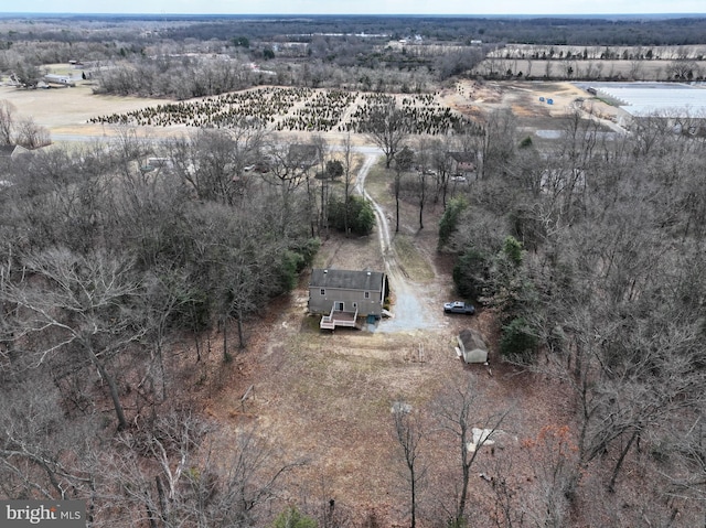 birds eye view of property featuring a rural view