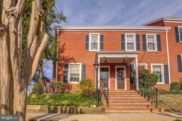 view of front of house with brick siding