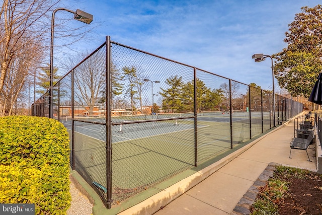 view of sport court with fence