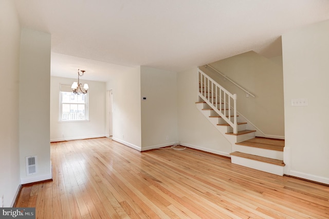 4911 29th Rd S, Arlington, VA 22206 - unfurnished living room featuring stairway, wood-type flooring, a chandelier, and baseboards
