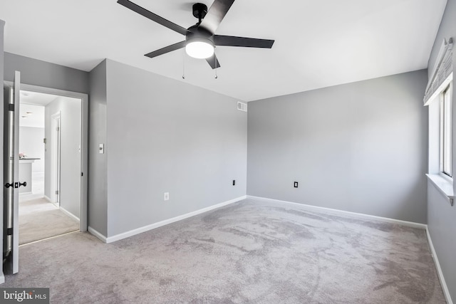 unfurnished bedroom with visible vents, baseboards, ceiling fan, and carpet flooring