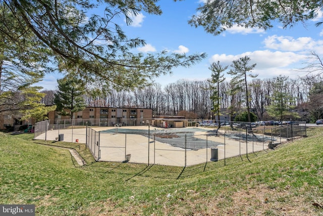 exterior space featuring a lawn and fence