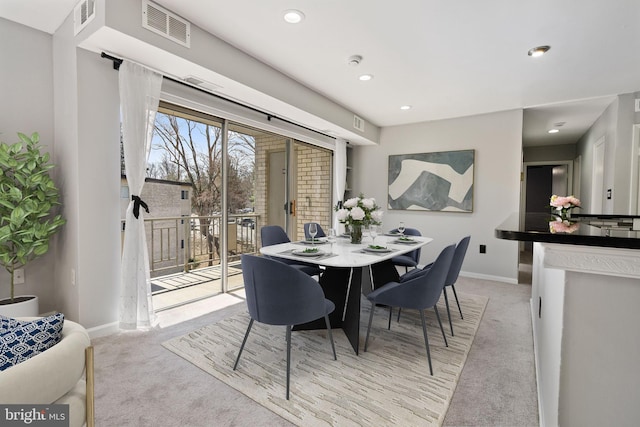 dining room featuring recessed lighting, visible vents, baseboards, and light colored carpet