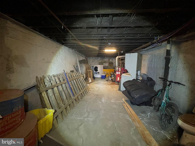 unfinished basement with washer / dryer