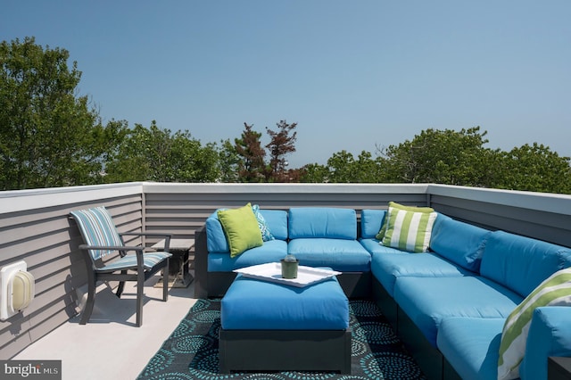 view of patio featuring an outdoor hangout area and a balcony