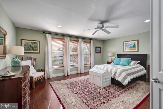 bedroom with dark wood finished floors, recessed lighting, a ceiling fan, and baseboards