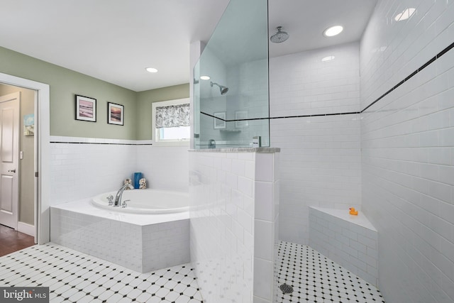 full bathroom featuring recessed lighting, a garden tub, and walk in shower