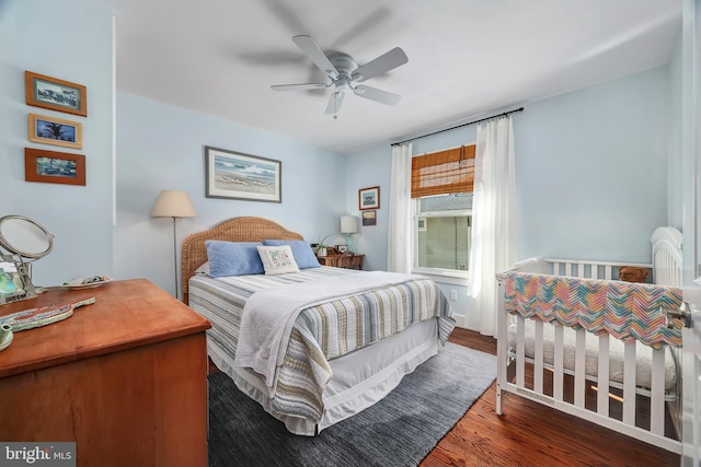 bedroom with a ceiling fan and wood finished floors