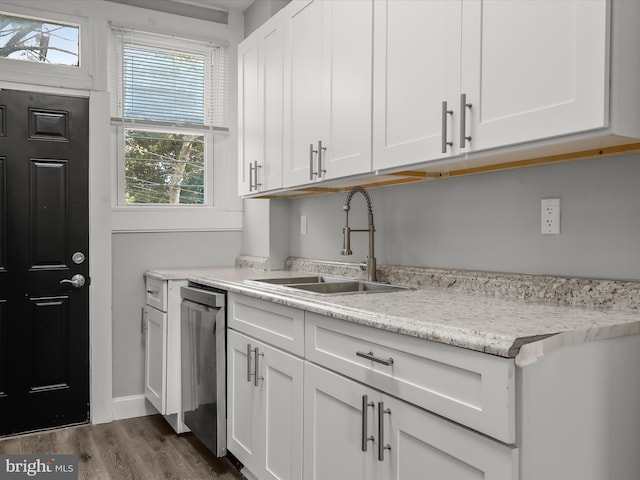 607 N Longwood St, Baltimore, MD 21216 - kitchen featuring dishwasher, white cabinets, dark wood finished floors, and a sink