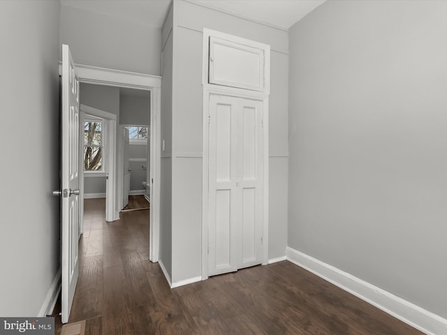 607 N Longwood St, Baltimore, MD 21216 - hallway with visible vents, baseboards, and dark wood-style flooring