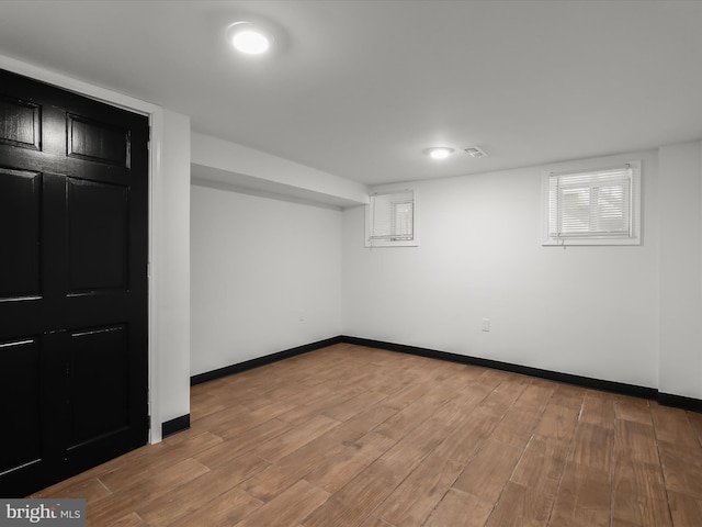 607 N Longwood St, Baltimore, MD 21216 - finished below grade area with baseboards and wood finished floors
